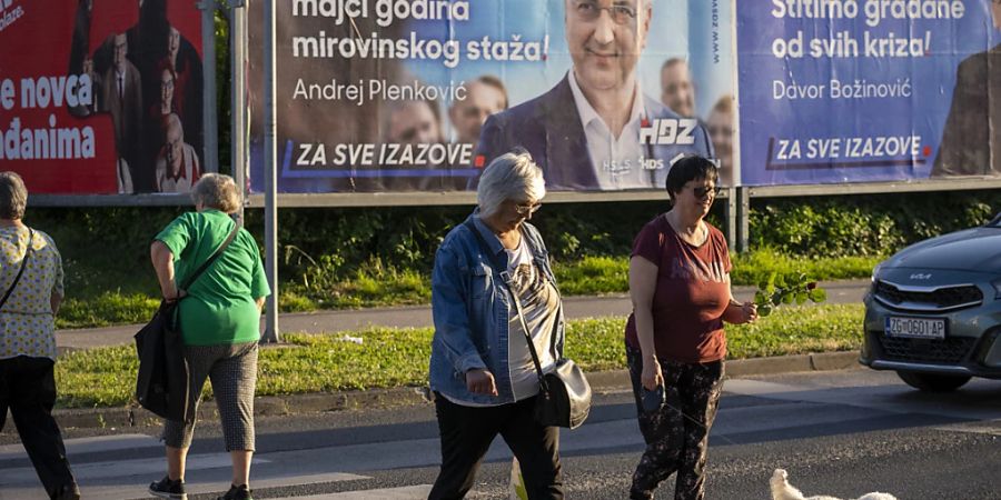 Wahlplakate in Zagreb: Kroatien wählt ein neues Parlament. Foto: Darko Bandic/AP/dpa