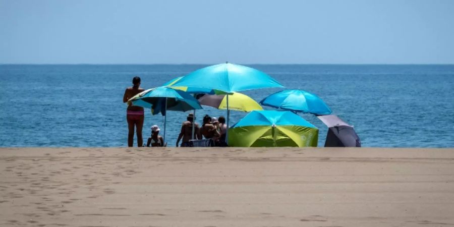 Urlauber am Strand
