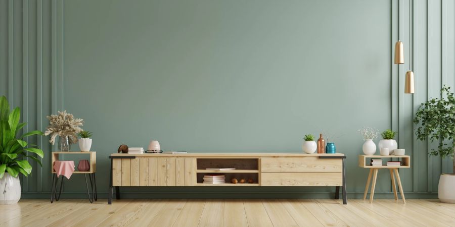 Sideboard für grüner Wand