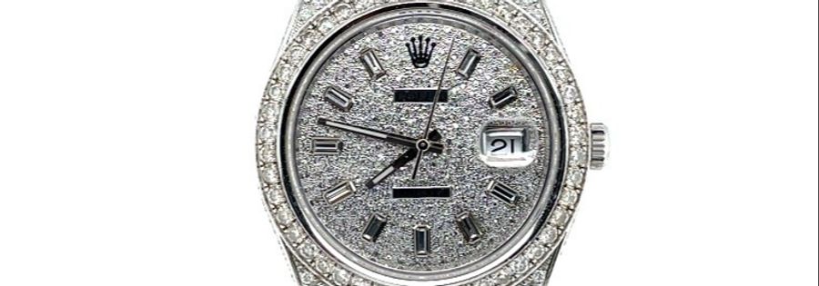 Ebenfalls wird diese mit Diamanten besetzte Rolex-Uhr versteigert.