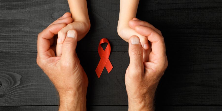 Schleife rot Hände Kind Mann