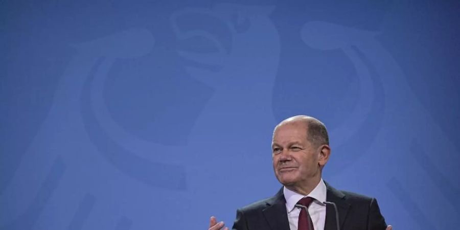 Der neue Bundeskanzler Olaf Scholz bei seiner Amtsübergabe. Foto: Michael Kappeler/dpa