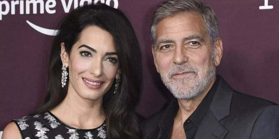 Etwa ein Jahr nach ihrer Hochzeit haben sie gemeinsam entschieden, Kinder haben zu wollen: Amal und George Clooney. Foto: Richard Shotwell/Invision/AP/dpa