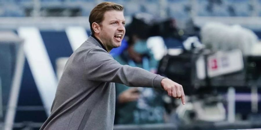 Bremens Trainer Florian Kohfeldt war mit dem Remis bei Eintracht Frankfurt zufrieden. Foto: Uwe Anspach/dpa