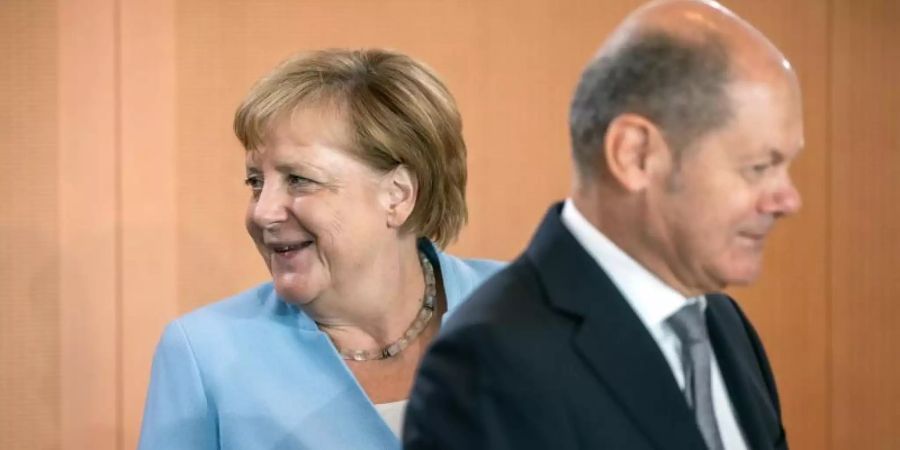 Kanzlerin Angela Merkel und Vizekanzler Olaf Scholz vor einer Kabinettssitzung im Kanzleramt. Foto: Michael Kappeler