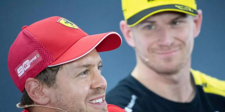 Freut sich über die Rückkehr von Nico Hülkenberg (r): Sebastian Vettel. Foto: Sebastian Gollnow/dpa