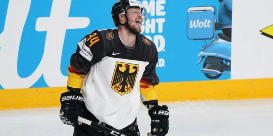 Die deutschen Eishockey-Cracks um Tom Kühnhackl verloren gegen die USA. Foto: Roman Koksarov/dpa