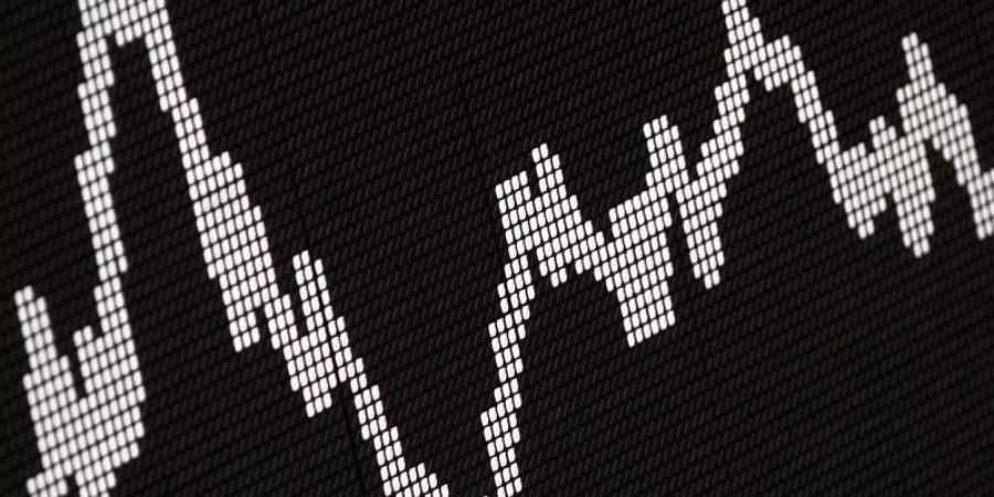 Der Deutsche Aktienindex (DAX) zeigt die Wertentwicklung der grössten deutschen Unternehmen. Foto: Frank Rumpenhorst/Illustration