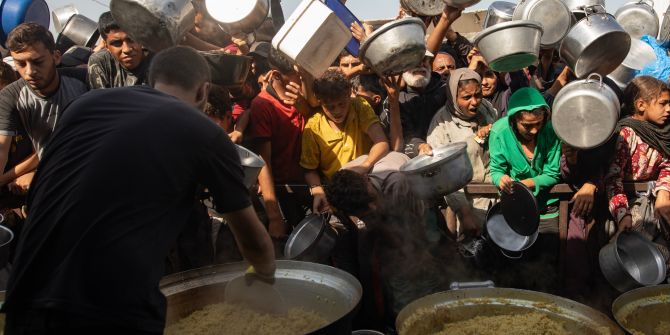 Displaced Palestinians receive food