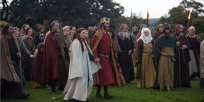 Robert und seine Ehefrau Elizabeth (Florence Pugh) versammeln eine Anhängerschaft um sich. Robert und seine Ehefrau Elizabeth (Florence Pugh) versammeln eine Anhängerschaft um sich.