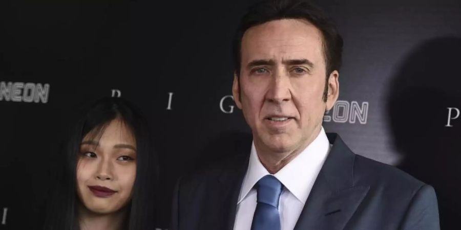 US-Schauspieler Nicolas Cage mit seiner Ehefrau Riko Shibata bei einer Filmpremiere in Los Angeles. Foto: Jordan Strauss/Invision via AP/dpa