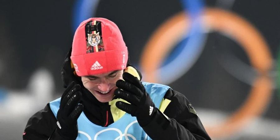 Kombinierer Vinzenz Geiger aus Deutschland gewinnt Gold bei den Winterspielen in Peking. Foto: Hendrik Schmidt/dpa