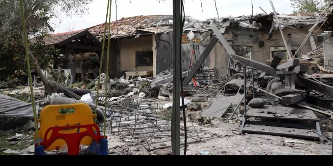 Israeli police examine missile hit damaged house