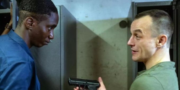 Mario (Paul Wollin, r) prahlt vor seinem Kollegen Man (Emmanuel Ajayi) mit seiner Pistole. Foto: Petro Domenigg/Filmstills.At K/ZDF/dpa Mario (Paul Wollin, r) prahlt vor seinem Kollegen Man (Emmanuel Ajayi) mit seiner Pistole. Foto: Petro Domenigg/Filmstills.At K/ZDF/dpa
