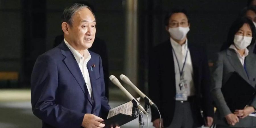 Japans Ministerpräsident Yoshihide Suga verkündet das Ende des Corona-Notstands in Japan. Foto: -/kyodo/dpa