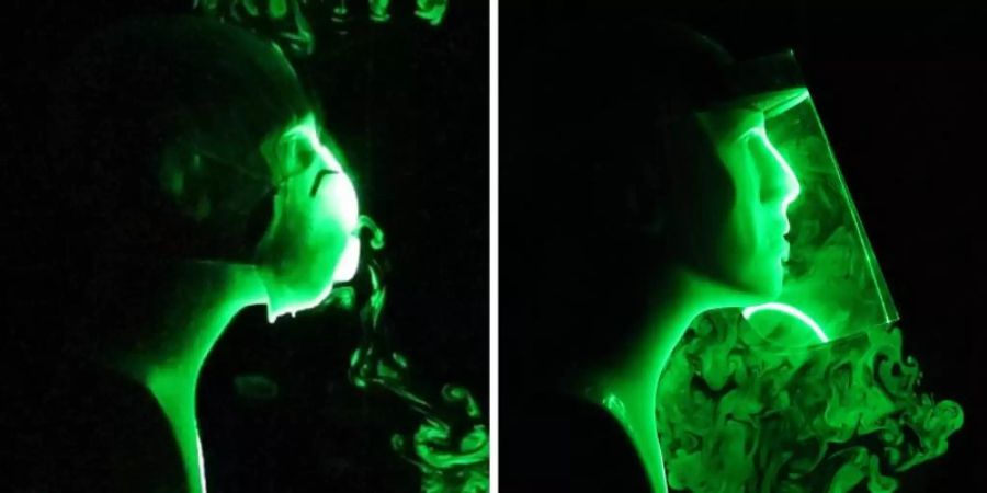 Die Bildkombo zeigt einen wissenschaftlichen Versuch, bei dem die Strömung künstlich hergestellter Atem-Tröpfchen beim Tragen einer N-95-Gesichtsmaske mit Ausatemventil (l) und einem Gesichtsschild (r) simuliert wird. Foto: -/Florida Atlantic University's College of Engineering and Computer Science/dpa