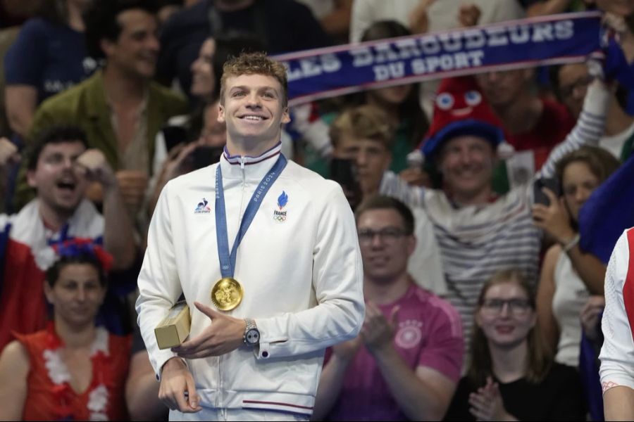 ... der vierfache Schwimm-Olympiasieger von Paris, Léon Marchand und ...