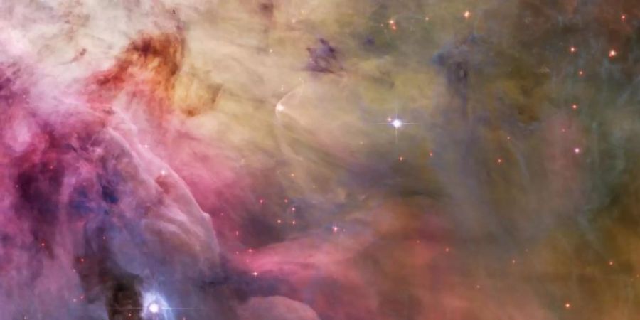 Der Stern LL Orionis zusammen mit dem Orionnebel. Foto: NASA/ESA/dpa