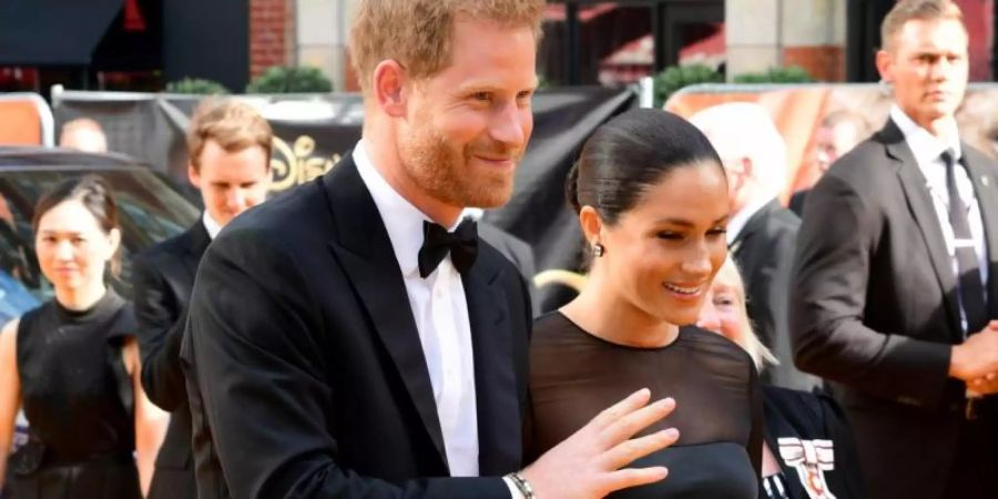 Prinz Harry mit seiner Frau Meghan bei der Europa-Premiere von «König der Löwen» in London. Foto: Ian West/PA Wire/