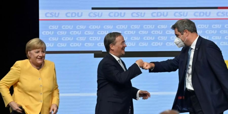Söder und Laschet mit Kanzlerin Merkel
