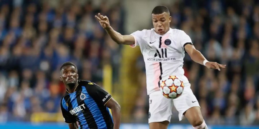 Müsste in Brügge zur Halbzeit ausgewechselt werden: PSG-Star Kylian Mbappé (r). Foto: Bruno Fahy/BELGA/dpa