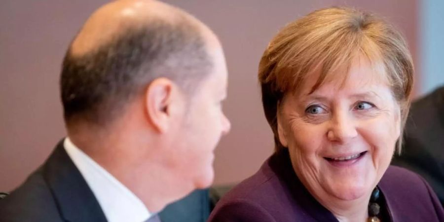 Bundeskanzlerin Angela Merkel (CDU) und Olaf Scholz (SPD), Bundesminister der Finanzen. Foto: Kay Nietfeld/dpa