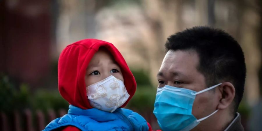 Menschen mit Masken in Peking