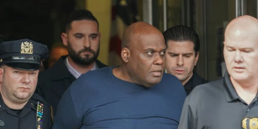Frank James (C), 63, has pleaded guilty to federal terror charges in connection with the April 2022 attack in a Brooklyn subway station