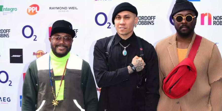 Die Hip-Hop-Band Black Eyed Peas (l-r), Apl.de.ap, Taboo und Will.i.am. Foto: Ian West/PA Wire/dpa