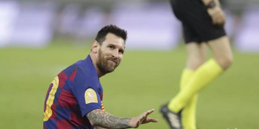20 Jahre FC Barcelona scheinen Lionel Messi nun genug zu sein. Foto: Hassan Ammar/AP/dpa
