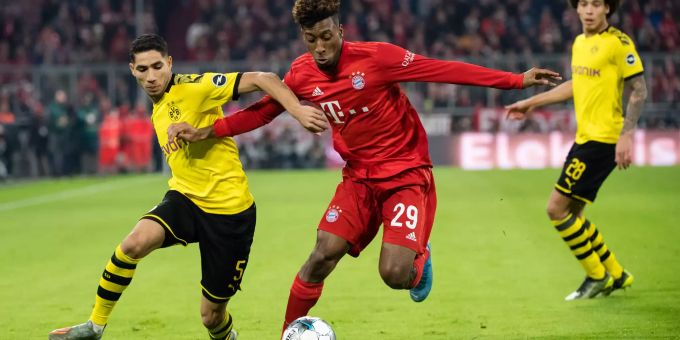 Achraf Hakimi (links) vom BVB im Zweikampf mit Bayerns Coman. BVB