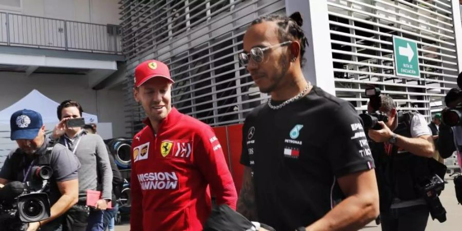 Nicht zufrieden mit der Strecke in Austin: Sebastian Vettel (l) und Lewis Hamilton. Foto: Marco Ugarte/AP/dpa