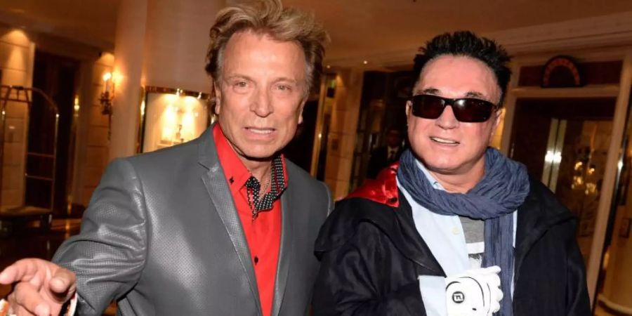 Untrennbar: Siegfried &amp; Roy. Foto: Felix Hörhager/dpa