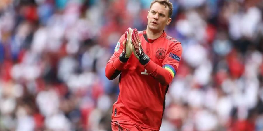 Keeper Manuel Neuer bleibt weiter der Kapitän der Fussball-Nationalmannschaft. Foto: Christian Charisius/dpa