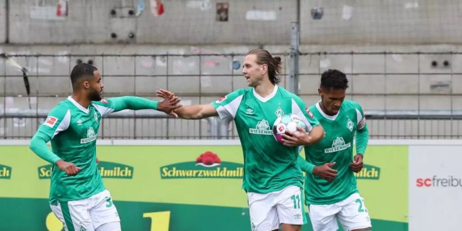 Rettete Werder einen Punkt in Freiburg: Niclas Füllkrug (M). Foto: Tom Weller/dpa