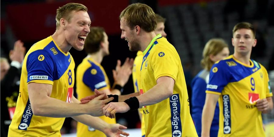 Schwedens Handballer haben einen harten Arbeitstag hinter sich.