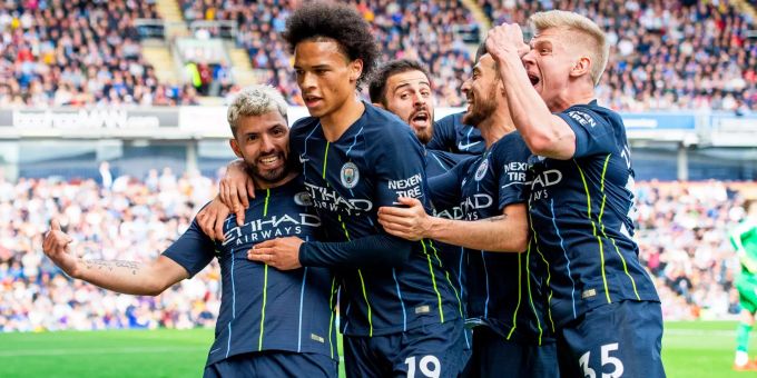 epa07534575 Manchester City's Sergio Aguero (L) celebrates with his teammates after scoring the 1-0 lead during the English Premier League soccer match between Burnley FC and Manchester City at the Turf Moor in Burnley, Britain, 28 April 2019. EPA/PETER POWELL EDITORIAL USE ONLY. No use with unauthorized audio, video, data, fixture lists, club/league logos or 'live' services. Online in-match use limited to 120 images, no video emulation. No use in betting, games or single club/league/player publications Burnley FC vs Manchester City FC