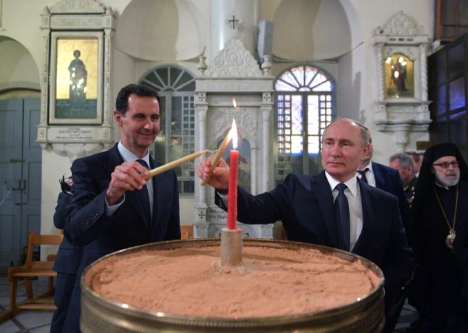 Ein Herz und eine Seele? Der russische Präsident Wladimir Putin und Baschar al-Assad beim Besuch einer Kathedrale in Damaskus. (Archivbild) Putin Assad Verbündete Syrien