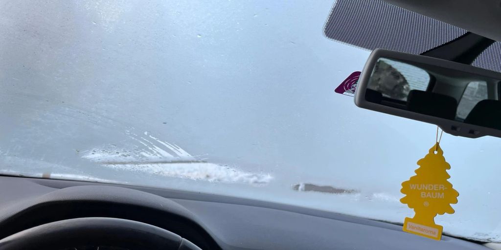 60 year old driver with a roadside iced window