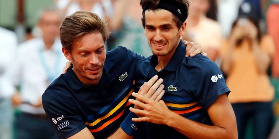 Pierre-Hugues Herbert und Nicolas Mahut nach ihrem Sieg.