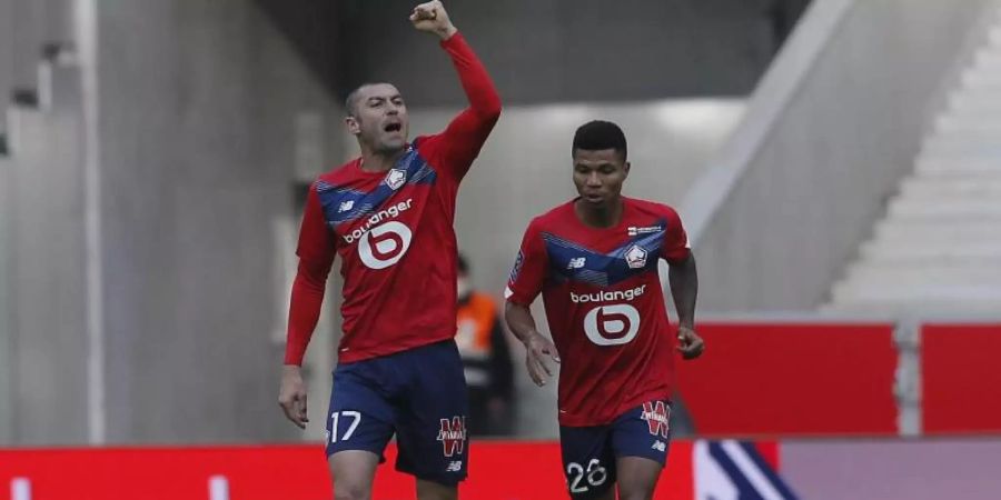 Lille-Stürmer Burak Yilmaz (l) traf in Lens doppelt. Foto: Michel Spingler/AP/dpa