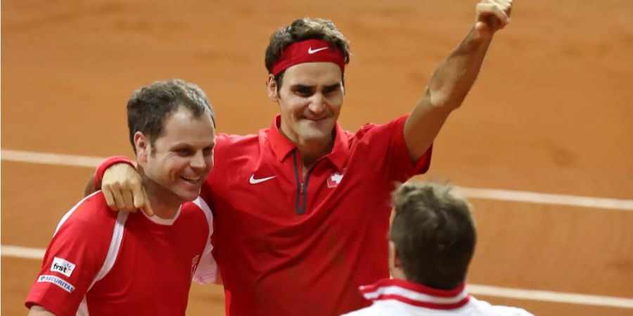 Severin Lüthi, Roger Federer und Stan Wawrinka jubeln über den Davis-Cup-Titel 2014.