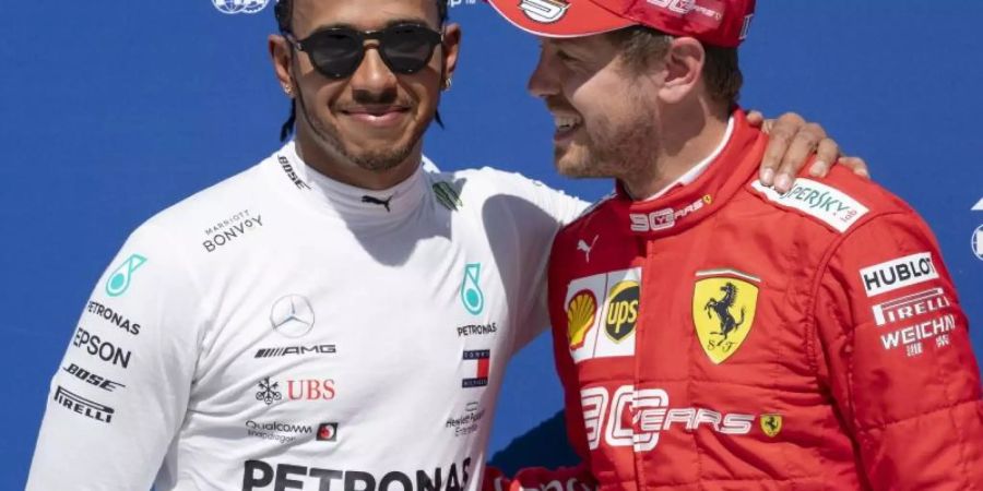 Lewis Hamilton (l) will Sebastian Vettel trotz seines grossen Vorsprungs nicht abschreiben. Foto: Paul Chiasson/The Canadian Press/AP