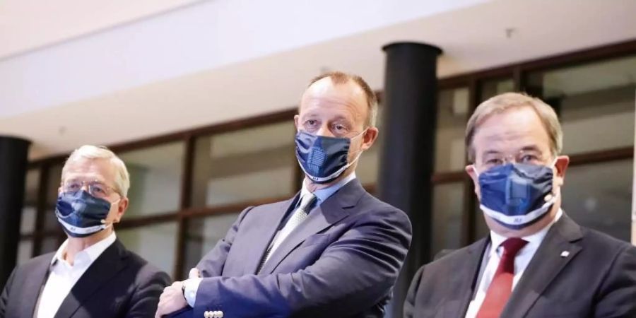 Die drei Kandidaten für den Bundesvorsitz der CDU: Armin Laschet, (r-l) Friedrich Merz und Norbert Röttgen. Foto: Michael Kappeler/dpa-pool/dpa