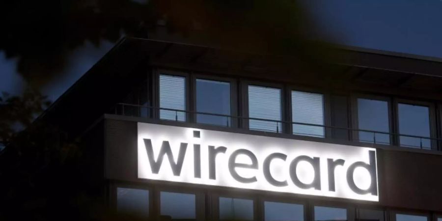 Der Schriftzug von Wirecard an der Firmenzentrale des Zahlungsdienstleisters. Foto: Tobias Hase/dpa