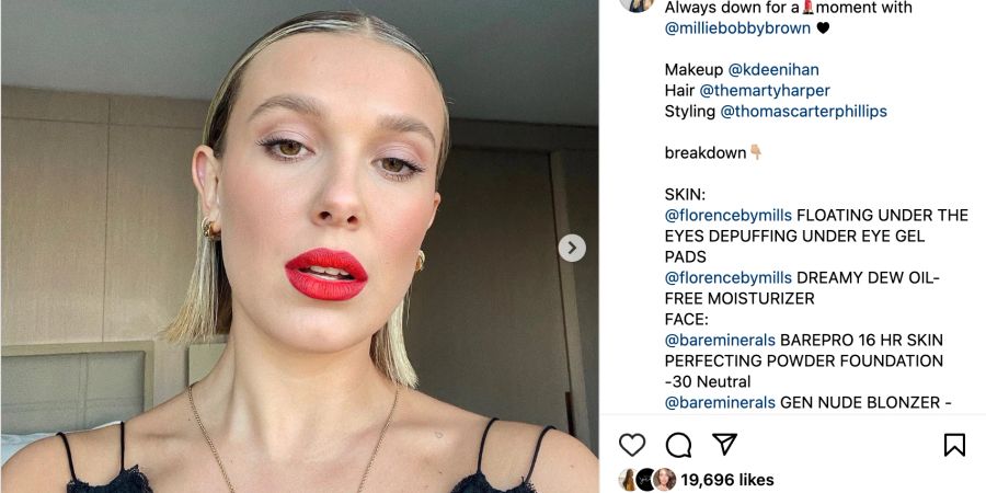 Instagram Post von Millie Bobbie Brown mit roten Lippen und zurück gegeltem Haar.