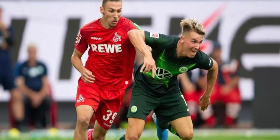 Darko Churlinov (l) in Aktion für den 1. FC Köln. Foto: Swen Pförtner/dpa