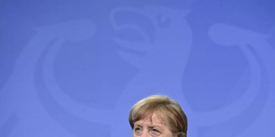 Kanzlerin Angela Merkel dämpft die Hoffnung auf schnelle Lockerungen in der Corona-Pandemie. Foto: John Macdougall/AFP Pool/dpa
