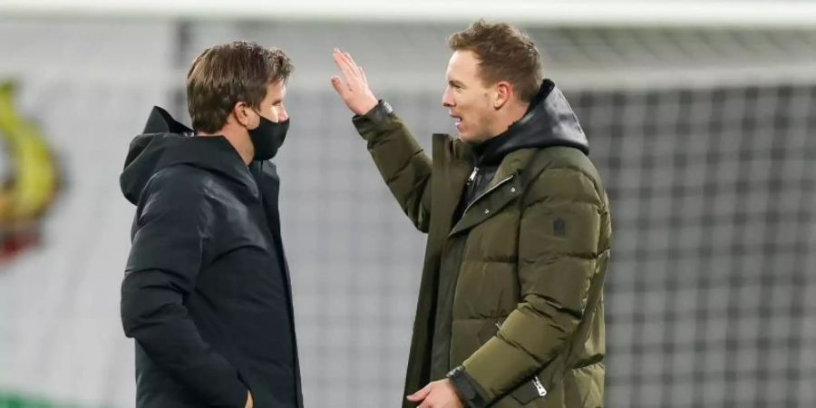 Sieht keinen Grund für einen Wechsel von Leipzig-Coach Julian Nagelsmann (r): RB-Sportdirektor Markus Krösche. Foto: Jan Woitas/dpa-Zentralbild/dpa