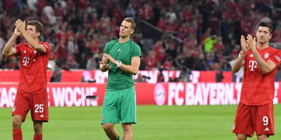 Zum Jahresanfang geht es für Thomas Müller (l-r), Manuel Neuer und Robert Lewandowski gegen den FSV Mainz, aber ohne Zuschauer. Foto: Sven Hoppe/dpa